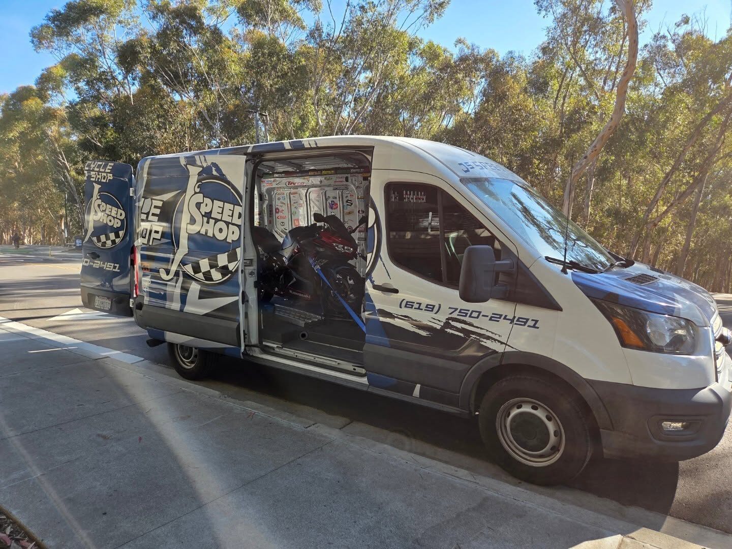 J's Speed Shop van loaded with a Kawasaki for pickup